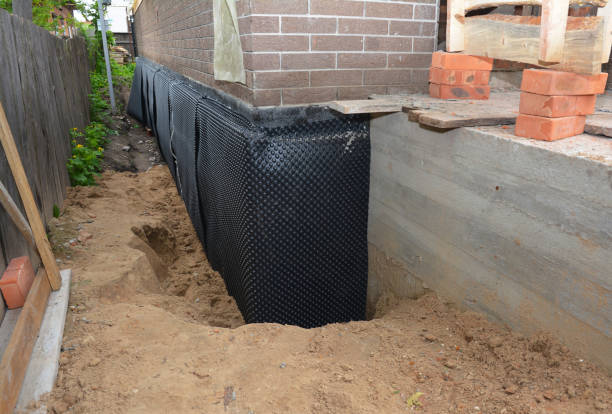 Happy homeowners after waterproofing job in Clay City